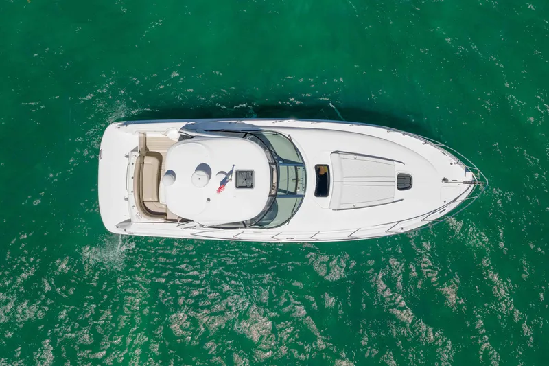 Slide: The Image of Aerial view of 2009 Sea Ray 40 Sundancer yacht on turquoise water. - 8