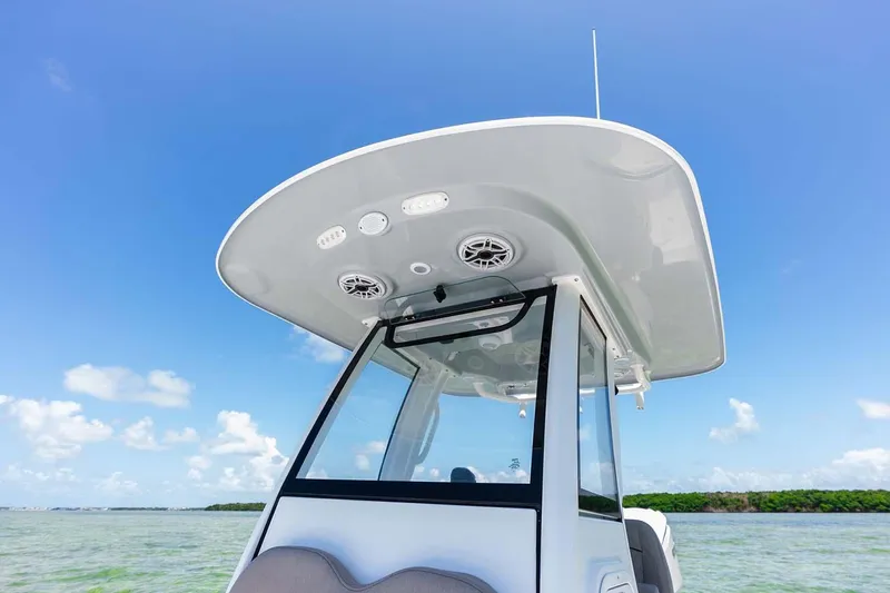 Slide: The Image of Manufacturer Provided Image: 2025 Sportsman Masters 247 Bay Boat with T-top against clear blue sky. - 12