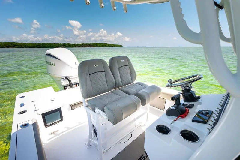 Slide: The Image of Manufacturer Provided Image: 2025 Sportsman Masters 247 Bay Boat interior with dual seats and ocean view. - 16