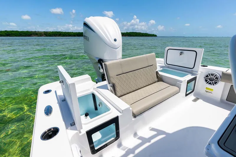 Slide: The Image of Manufacturer Provided Image: 2025 Sportsman Masters 247 Bay Boat on clear water, featuring comfortable seating and storage. - 18