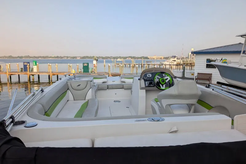 Slide: The Image of 2018 Starcraft MDX 211 O/B boat interior at a marina with dock view. - 10