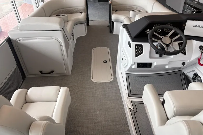 Slide: The Image of Interior of 2026 Crest 230 SLRC Caribbean boat with luxurious seating and modern dashboard. - 7