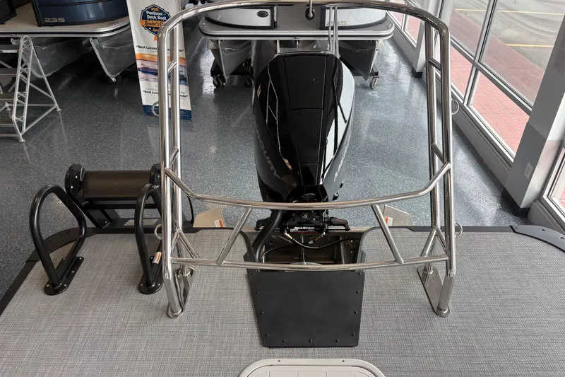 Slide: The Image of 2026 Crest 230 SLRC Caribbean boat with sleek motor and sturdy railing in showroom. - 8