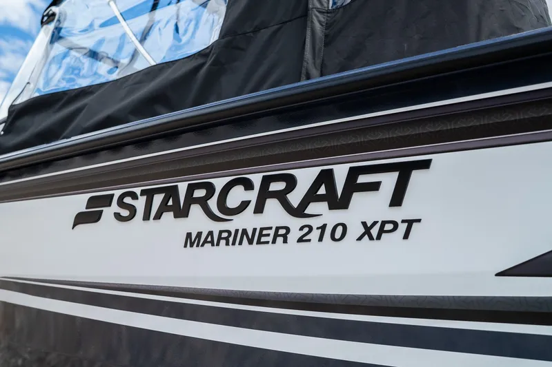 Slide: The Image of Starcraft Mariner 210 XPT boat, 2026 model, close-up of logo. - 2