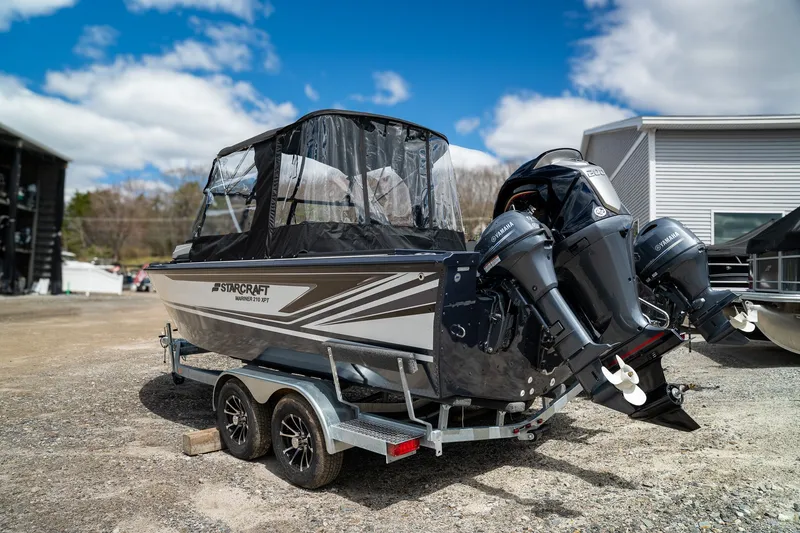 Slide: The Image of Starcraft Mariner 210 XPT 2026 on trailer with dual outboard motors. - 7