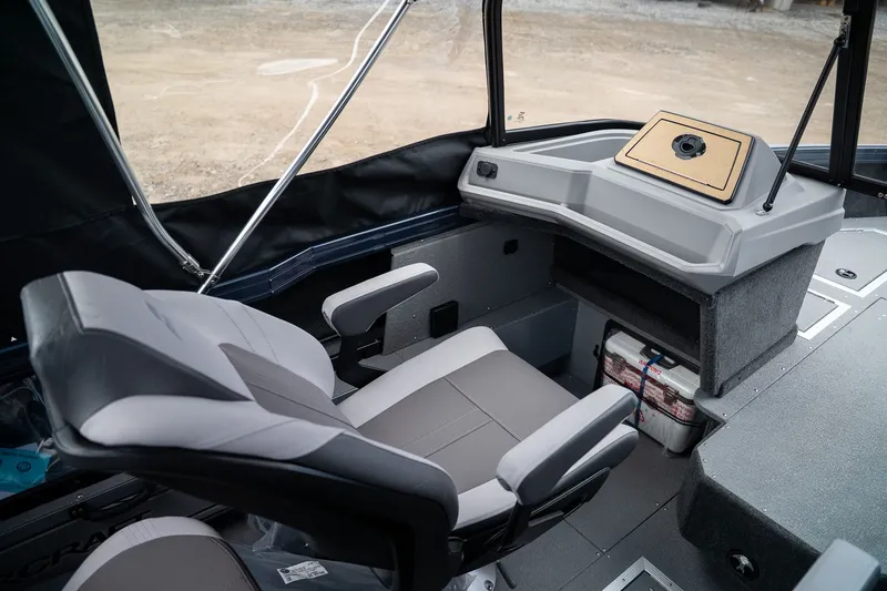 Slide: The Image of Interior of 2026 Starcraft Mariner 210 XPT with seat and console. - 8