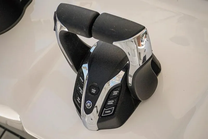 Slide: The Image of Throttle control of 2026 Tidewater 3100 Carolina Bay boat, featuring ergonomic design and controls. - 13