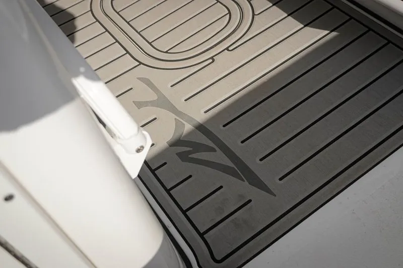 Slide: The Image of Deck flooring of 2026 Tidewater 3100 Carolina Bay boat with logo design. - 18