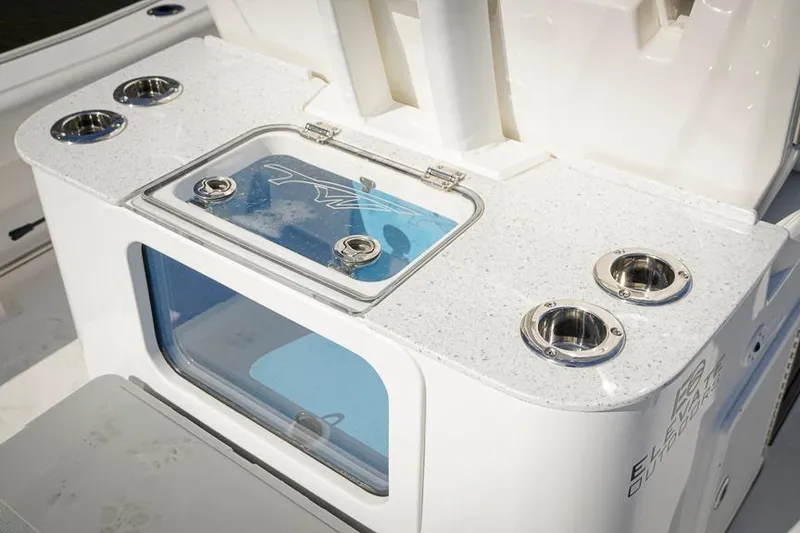 Slide: The Image of Tidewater 3100 Carolina Bay 2026 boat console with rod holders and storage compartment. - 29