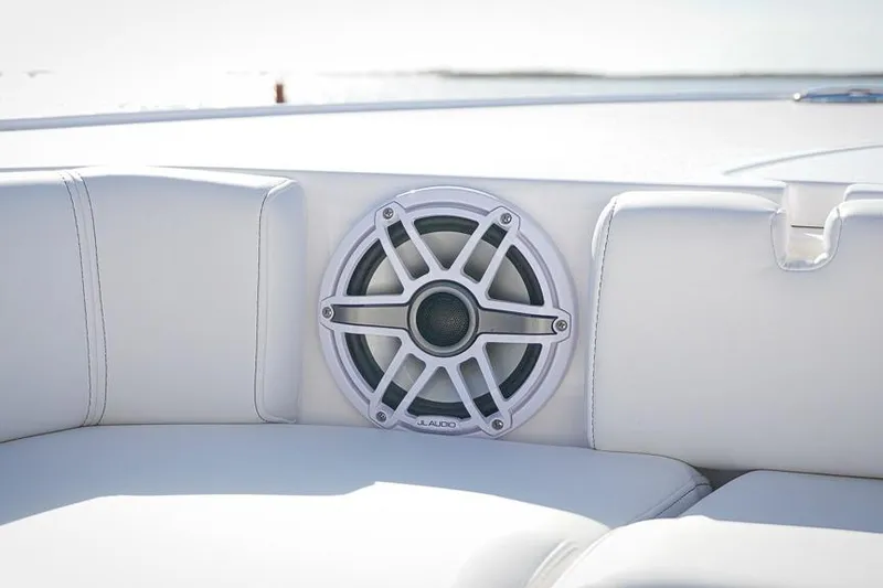 Slide: The Image of Speaker on 2026 Tidewater 3100 Carolina Bay boat, featuring white cushioned seating. - 35