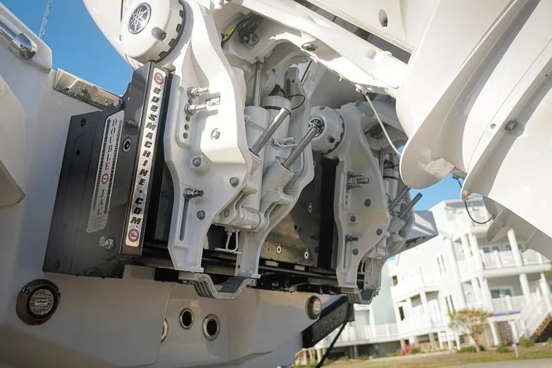 Slide: The Image of 2026 Tidewater 3100 Carolina Bay boat engine mount detail with hydraulic components. - 39