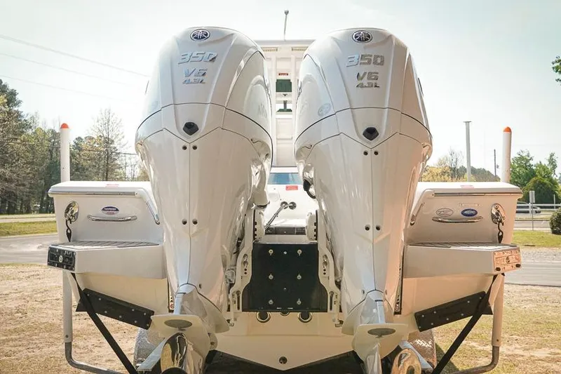 Slide: The Image of 2026 Tidewater 3100 Carolina Bay boat with dual 350 V6 engines, rear view. - 6