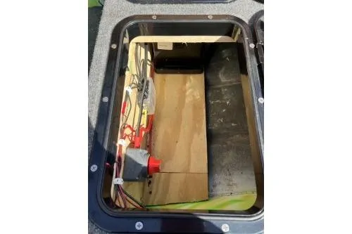 Slide: The Image of Open storage compartment in a 1968 Polar Kraft Jon 1436 LW boat. - 11