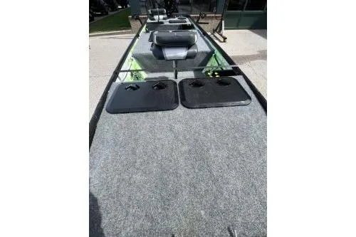 Slide: The Image of 1968 Polar Kraft Jon 1436 LW boat with carpeted deck and storage compartments. - 3