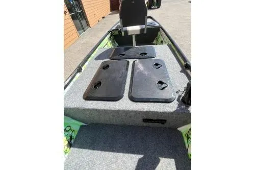 Slide: The Image of 1968 Polar Kraft Jon 1436 LW boat interior with storage compartments and seating. - 5