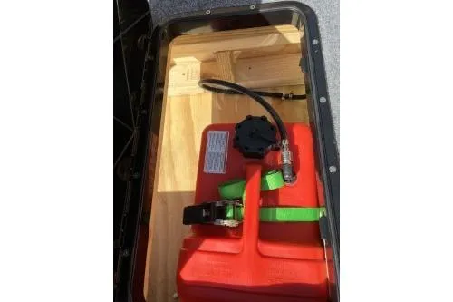 Slide: The Image of Red fuel tank inside a 1968 Polar Kraft Jon 1436 LW boat compartment. - 7