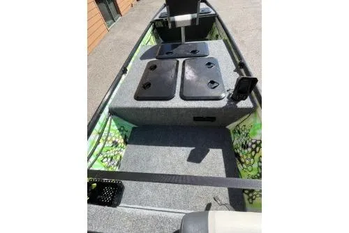 Slide: The Image of 1968 Polar Kraft Jon 1436 LW boat interior with storage compartments and seating. - 9