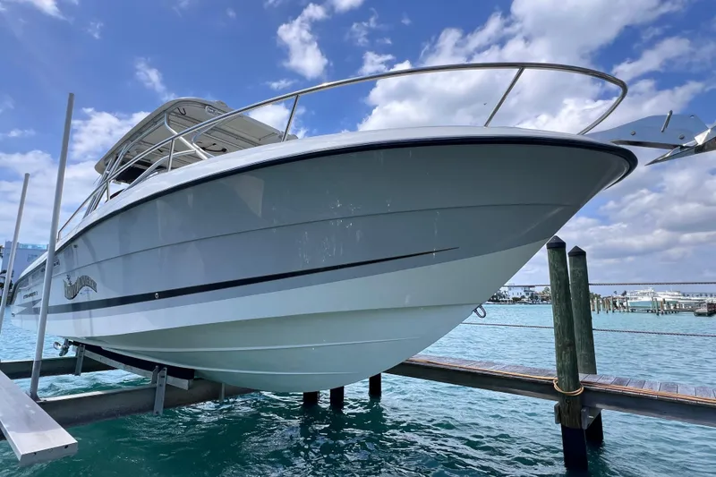 Slide: The Image of 2005 Hydra-Sports Vector 3300 VX boat docked on a sunny day. - 11