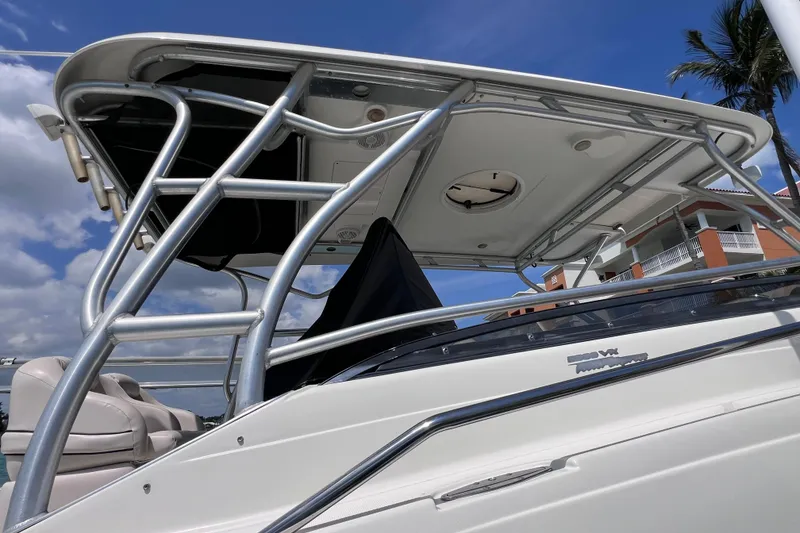 Slide: The Image of 2005 Hydra-Sports Vector 3300 VX boat with T-top, under clear blue sky. - 13