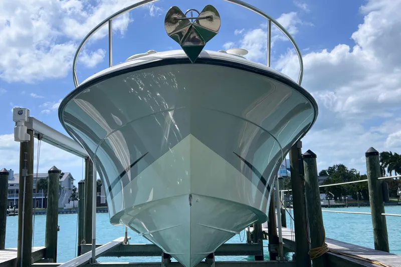 Slide: The Image of 2005 Hydra-Sports Vector 3300 VX boat docked, viewed from the front under a clear sky. - 14