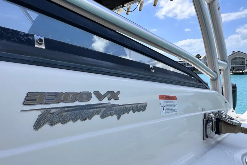 Slide: The Image of 2005 Hydra-Sports Vector 3300 VX boat side view with logo and warning label. - 16