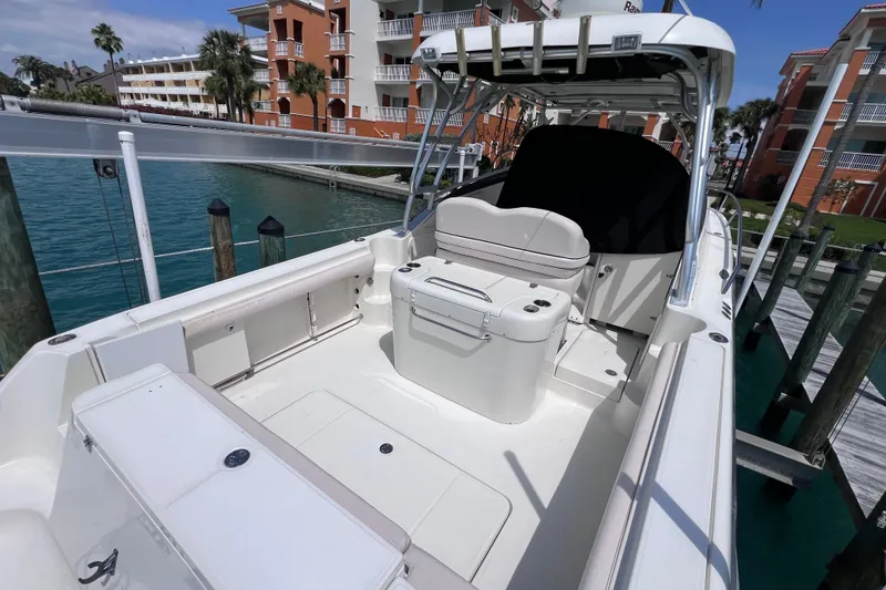 Slide: The Image of 2005 Hydra-Sports Vector 3300 VX boat docked near waterfront buildings. - 19