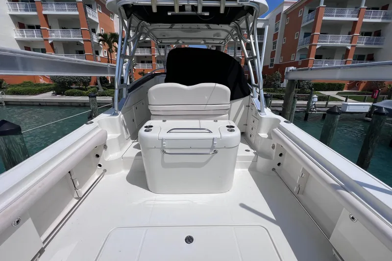 Slide: The Image of 2005 Hydra-Sports Vector 3300 VX boat docked, featuring spacious deck and seating area. - 20