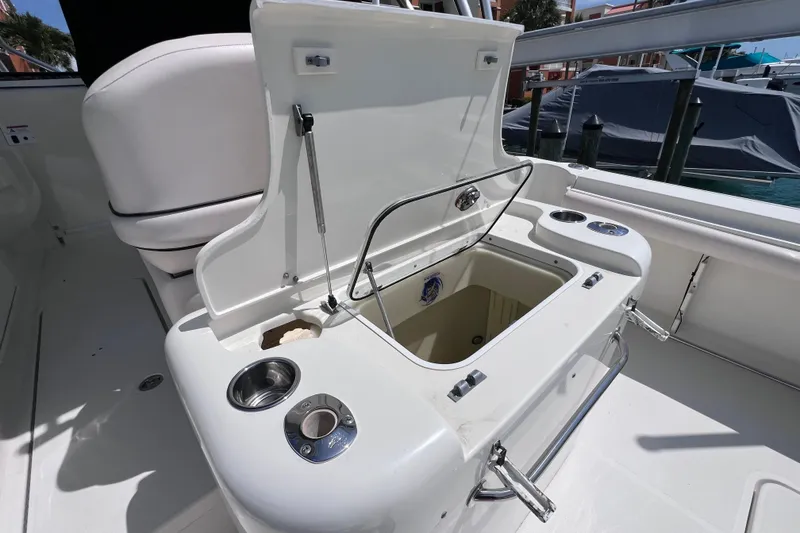 Slide: The Image of 2005 Hydra-Sports Vector 3300 VX boat interior with open storage compartment and cup holders. - 31