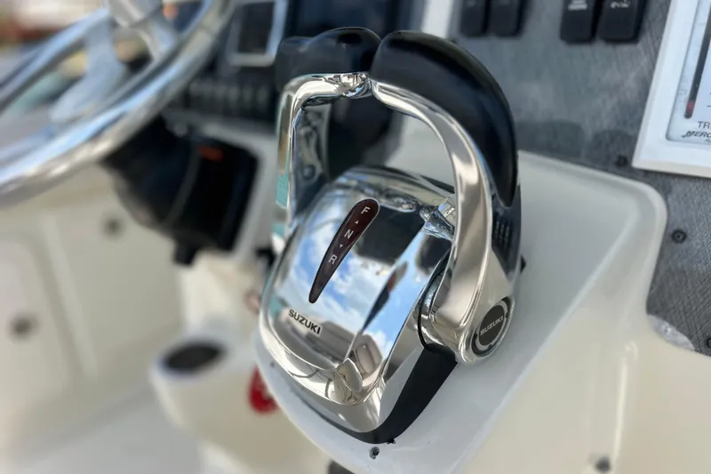 Slide: The Image of Throttle controls on a 2005 Hydra-Sports Vector 3300 VX boat dashboard. - 36