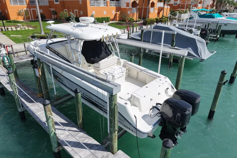 Slide: The Image of 2005 Hydra-Sports Vector 3300 VX boat docked in marina with twin engines. - 4
