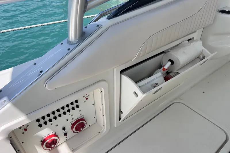 Slide: The Image of 2005 Hydra-Sports Vector 3300 VX boat interior storage and control panel. - 40