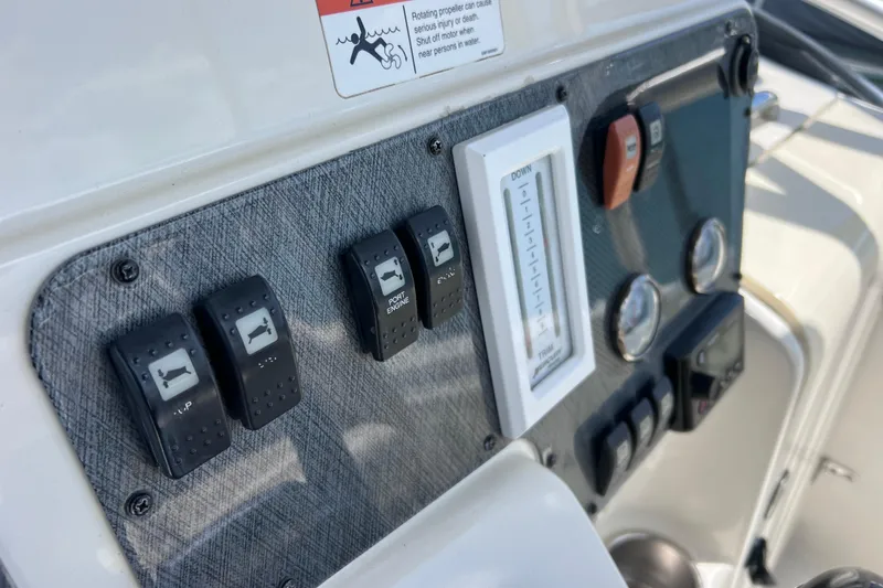 Slide: The Image of Control panel of a 2005 Hydra-Sports Vector 3300 VX boat with switches and gauges. - 45