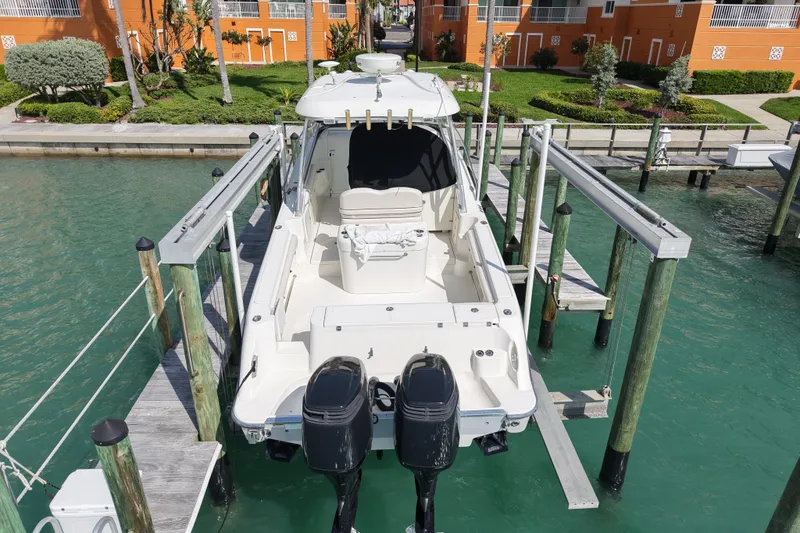 Slide: The Image of 2005 Hydra-Sports Vector 3300 VX boat docked on a lift in a marina. - 5