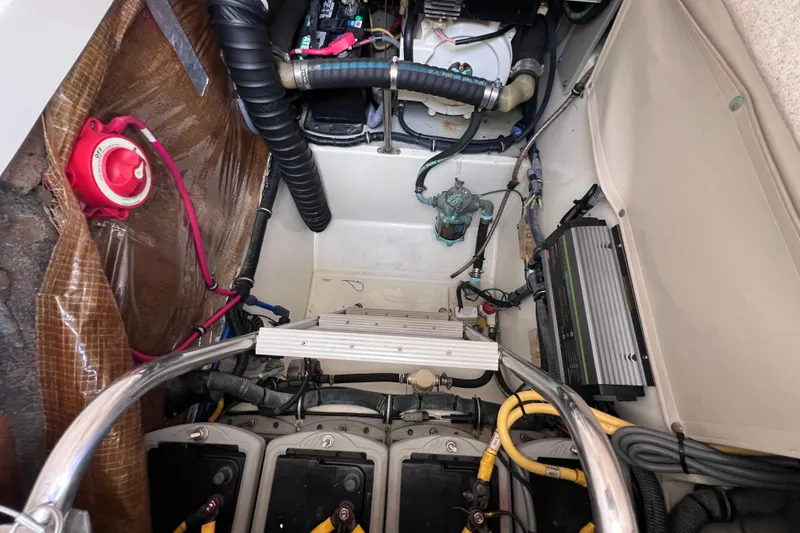 Slide: The Image of Engine compartment of a 2005 Hydra-Sports Vector 3300 VX boat, showing wiring and components. - 52