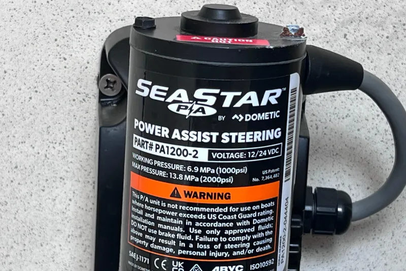 Slide: The Image of SeaStar power assist steering unit for Hydra-Sports Vector 3300 VX, 2005 model, by Dometic. - 53