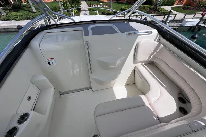 Slide: The Image of 2005 Hydra-Sports Vector 3300 VX boat interior with white seating and cup holders. - 59
