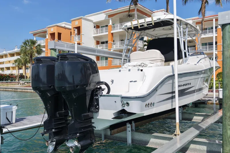 Slide: The Image of 2005 Hydra-Sports Vector 3300 VX boat docked near waterfront buildings. - 6