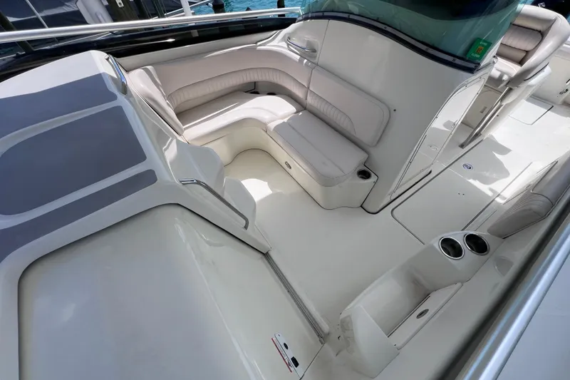 Slide: The Image of 2005 Hydra-Sports Vector 3300 VX boat interior with white seating and cup holders. - 60