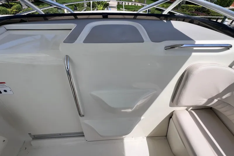 Slide: The Image of 2005 Hydra-Sports Vector 3300 VX boat interior with seating and stainless steel handrails. - 61