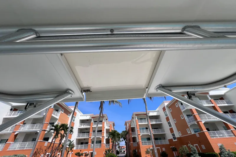 Slide: The Image of View from a 2005 Hydra-Sports Vector 3300 VX boat, overlooking tropical buildings and palm trees. - 63