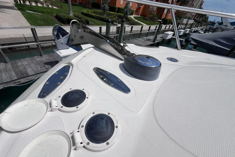 Slide: The Image of 2005 Hydra-Sports Vector 3300 VX boat deck with anchor and hatches at marina. - 65