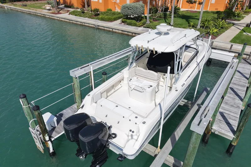 Slide: The Image of 2005 Hydra-Sports Vector 3300 VX boat docked on turquoise water. - 7