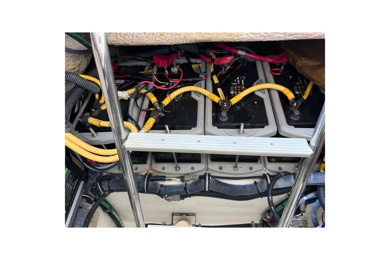 Slide: The Image of 2005 Hydra-Sports Vector 3300 VX boat battery compartment with wiring and connections. - 72