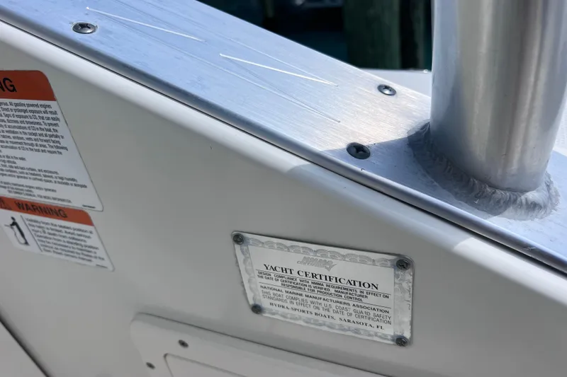 Slide: The Image of 2005 Hydra-Sports Vector 3300 VX yacht certification plate and warning labels. - 74