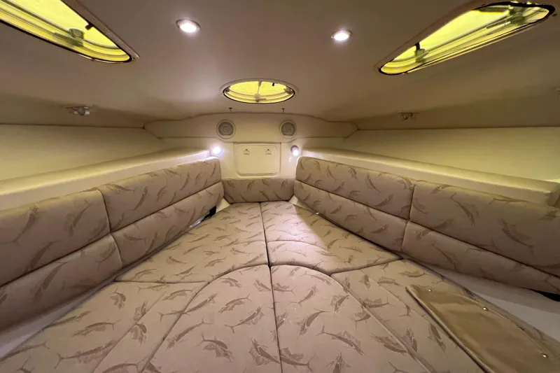 Slide: The Image of Interior cabin of 2005 Hydra-Sports Vector 3300 VX with cushioned seating and ambient lighting. - 77