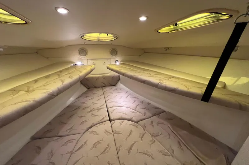 Slide: The Image of 2005 Hydra-Sports Vector 3300 VX cabin interior with cushioned seating and ambient lighting. - 79