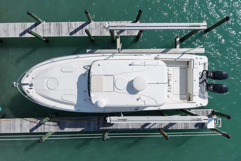 Slide: The Image of Overhead view of 2005 Hydra-Sports Vector 3300 VX docked on turquoise water. - 8