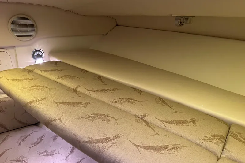 Slide: The Image of 2005 Hydra-Sports Vector 3300 VX cabin interior with fish-patterned upholstery and ambient lighting. - 81