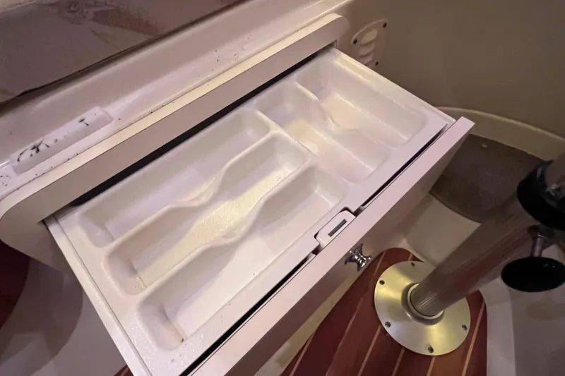 Slide: The Image of Open storage compartment in 2005 Hydra-Sports Vector 3300 VX boat interior. - 84