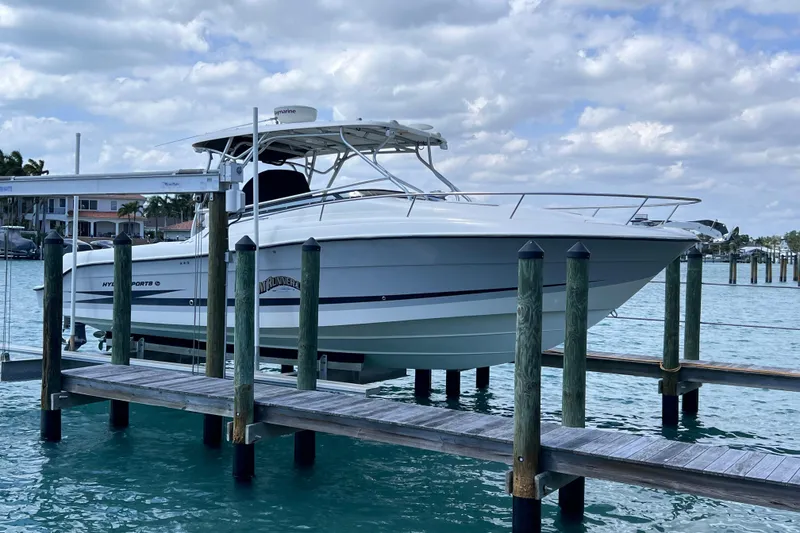 Slide: The Image of 2005 Hydra-Sports Vector 3300 VX boat docked on a sunny day. - 9